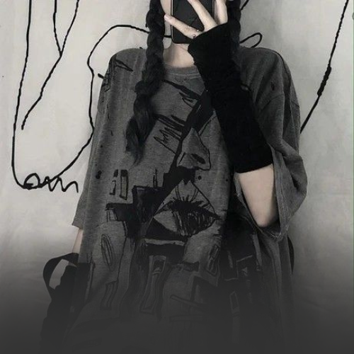 woman wearing oversized dark grey graphic shirt