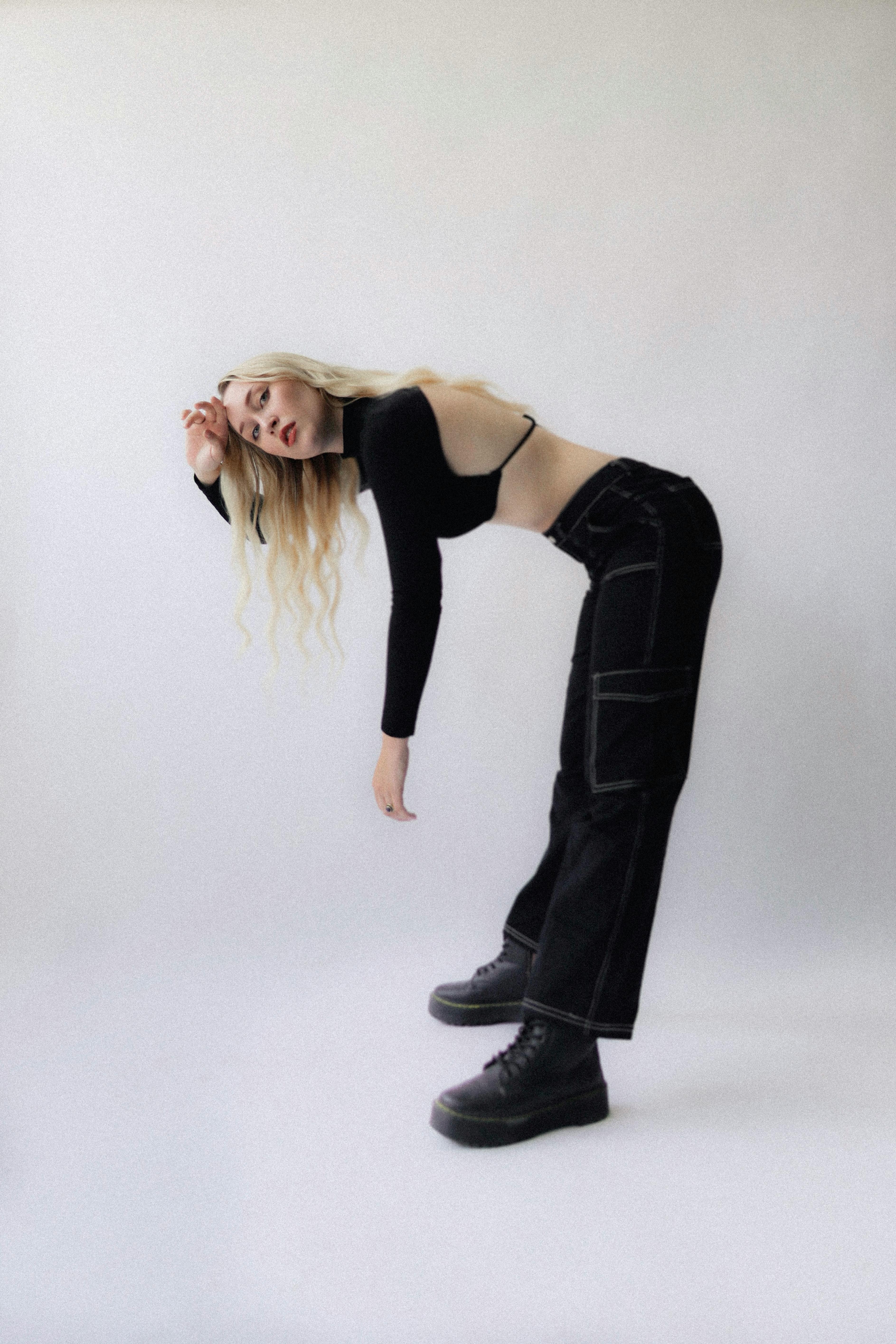 model wearing black cargo pants