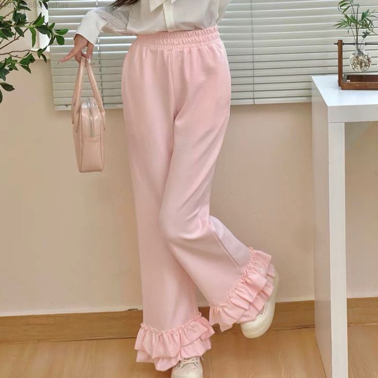 woman wearing ruffle flared pants