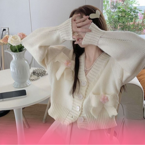 woman wearing cute bow white sweater