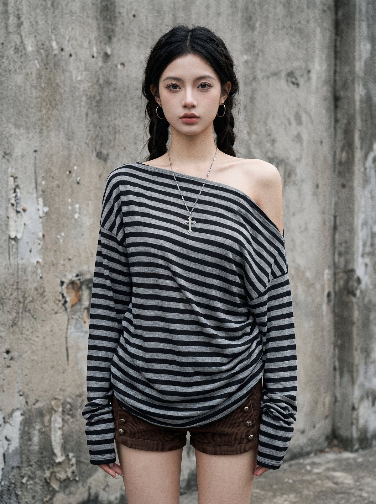 Woman wearing the grey and black off the shoulder striped shirt, full length