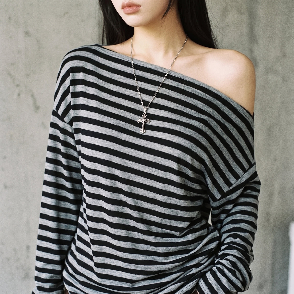 Close-up of the off the shoulder striped shirt neckline and stripe pattern
